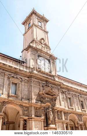 The Giureconsulti palace with clock tower on Mercanti square near Duomo square in Milan city center