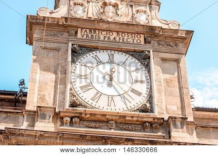 Clock on the tower of Giureconsulti palace in the center of Milan