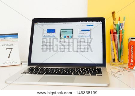 PARIS FRANCE - SEP 8 2016: Apple Computers website on MacBook Pro Retina in a geek creative room environment showcasing Calendar Suggested apps and Multilingual Typing on ios 10