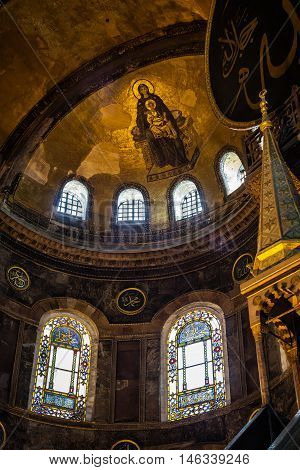 ISTANBUL TURKEY - APRIL 15 2015 : Painted Madonna with baby Jesus on ceiling in Hagia Sophia ancient basilica. Hagia Sophia served as a model for many other Ottoman mosques