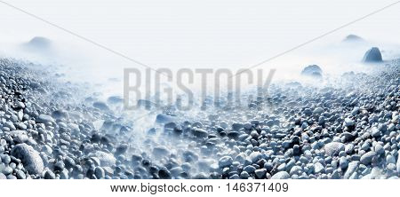 Background of water and rolling stones at Moelen