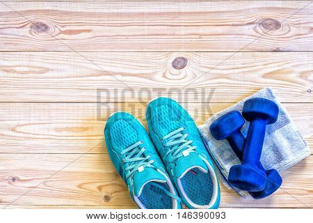 Flat Lay Shot Of Sport Equipment, Shoes On Wooden Background