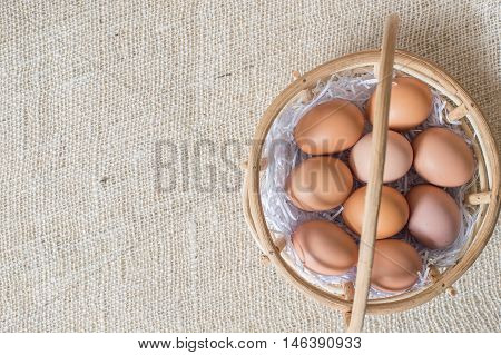Eggs In Bamboo Basket On Jute Sack