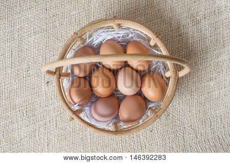 Eggs In Bamboo Basket On Jute Sack