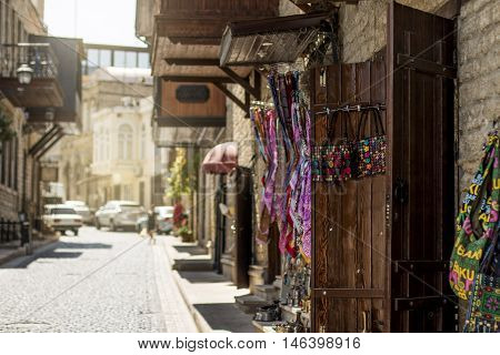 Ancent streets of old city Baku, surrounded by many sellers of cultural things.