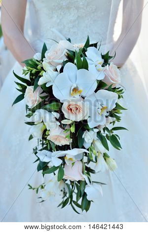 Beautiful Bride Is Holding A Wedding Colorful Bouquet. Beauty Of Colored Flowers. Close-up Bunch Of
