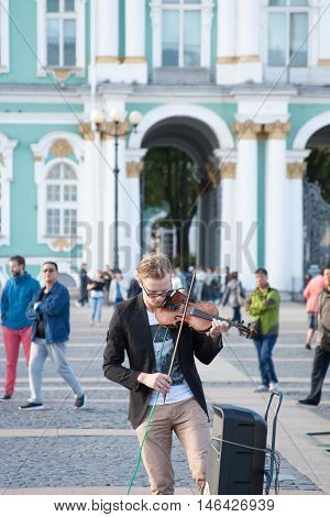 St. Petersburg, Russia-september 09,2016: The Street Musician Plays On The Street Of St. Petersburg.