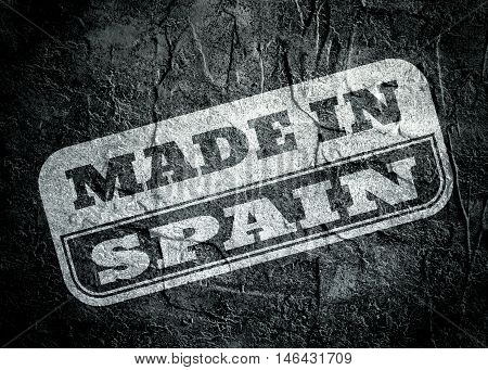 Stamp with made in Spain text over concrete textured background