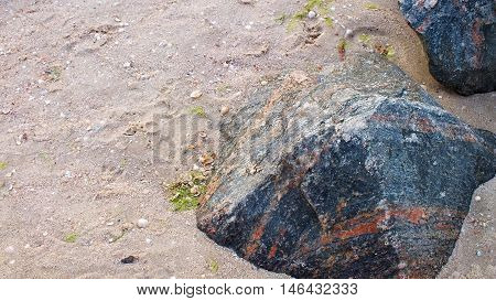 Photo beach with large granite rocks. Picture taken in August 2016.