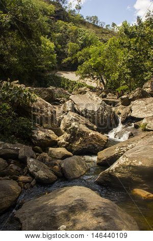 Water Falls Between Rocks In Sunny Day - Serra Da Canastra National Park - Minas Gerais, Brazil