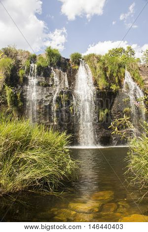 Beautiful waterfall between rocks in sunny day.