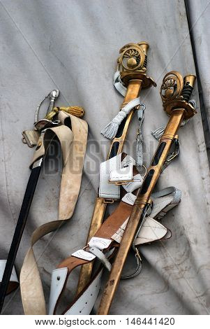 BORODINO MOSCOW REGION - SEPTEMBER 04 2016: Vintage swords shown at Borodino battle historical reenactment in Russia. Color photo. Reenactors belongings.