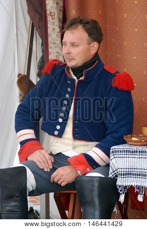 BORODINO MOSCOW REGION - SEPTEMBER 04 2016: Reenactor dressed as Napoleonic war soldier at Borodino battle historical reenactment in Russia. Color photo.