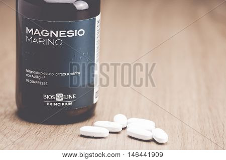 Inverigo, Italy - September 9, 2016: marine magnesium citrate tablets Bios Line nutritional supplement in a glass bottle