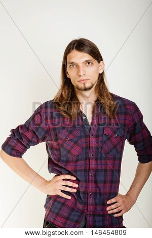 Masculinity concept. Man in plaid shirt. Young male posing on white background.