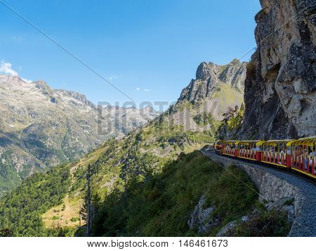 train of Artouste with cliffs in the french mountains Pyrenees