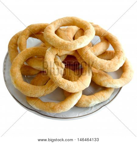 Cookies pretzels served in a plate on a white background