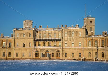 GATCHINA, RUSSIA - JANUARY 22, 2016: The facade of the Big Gatchina Palace closeup in the rays of the setting sun on a january evening. Historical landmark of the city Gatchina