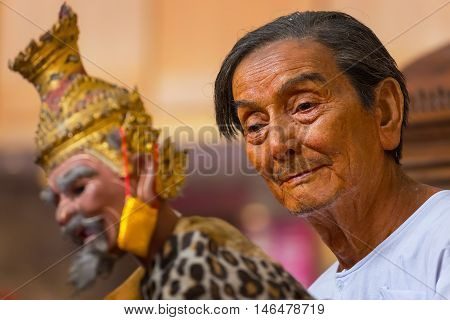 Bangkok Thailand - January 16 2016: Waxwork of Mr. Sakorn Yankeosod (A.K.A. Joe Louis) the master of thai traditional puppet displayed in the occasion of celebrating H.R.H. Princess Sirindhorn's birthday