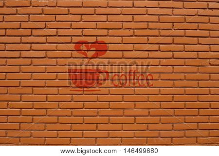 The big wall by the brick with coffee sign
