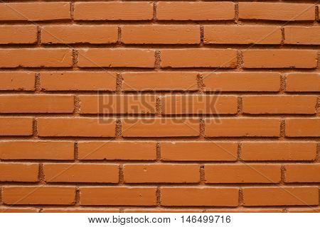 The big wall by the brick with brown color