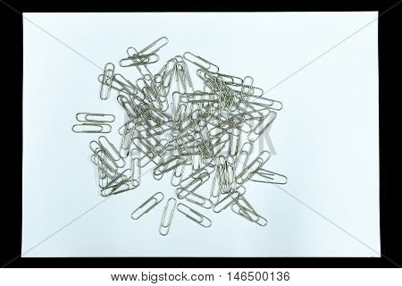 Clear paper and paper clip is isolated on black background