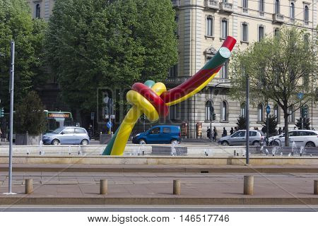 MILAN, ITALY - APRIL 16 2015: Knot giant sculpture in Milan Piazza Cadorna with milanese building in the background