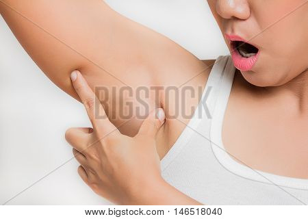 woman worry and holding her arms up and showing underarms