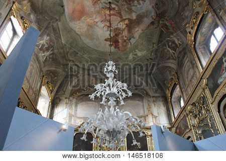 MILAN, ITALY - APRIL 16 2015: Room of Palazzo Litta in Milan ceiling decorated with fresco and a chandelier