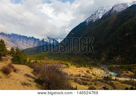Landscapes Snow Mountains Peak Nature Morning Viewpoint.Mountain Trekking Landscape Background. Nobody photo. Horizontal picture. Sunlights White Clouds Blue Sky.Asia Himalayas Rocks Hikking Sport