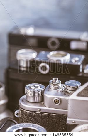 Old cameras closeup shot. Selective focus Toned