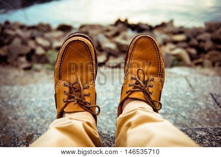 close-up view of man's leather top sider shoes