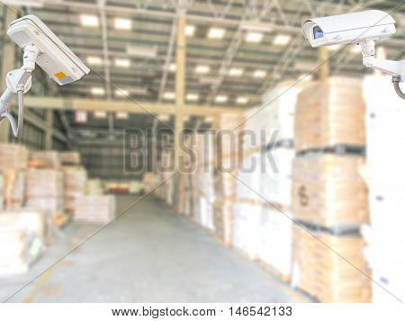 CCTV system security in warehouse of factory chemical blur background.