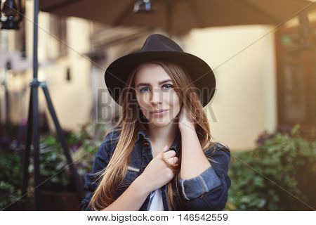 Portrait of beautiful smiling girl. Close up. Model looking at camera. Toned