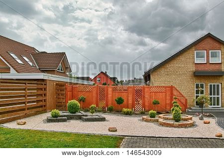 Сourtyard of House under the Cloudy Sky