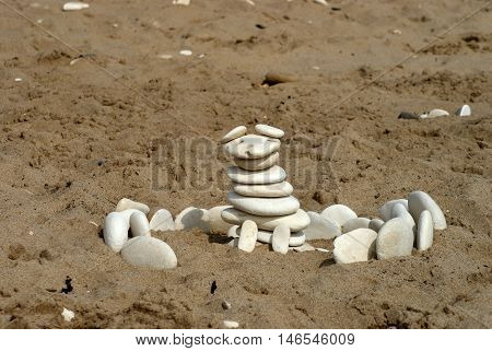 A sculpture made out of pebbles found on the beach