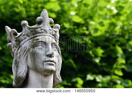 Poissy France - august 6 2016 : the statue of the king Saint Louis near the collegiate church