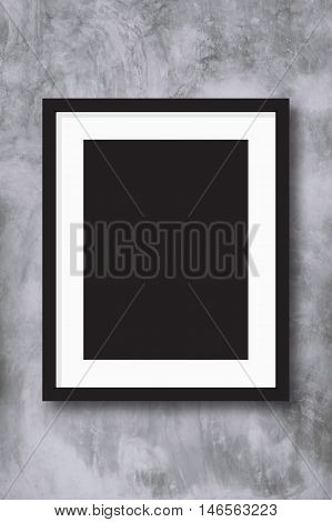 Black photo frame on concreate wall background for design pattern artwork.