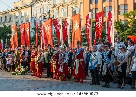 KRAKOW, POLAND - FEB 10, 2016: Unidentified participants of ceremony is the vow of first classes of the Jan III Sobieski High School (founded in 1883) at the Main Market Square near St.Mary Cathedral.
