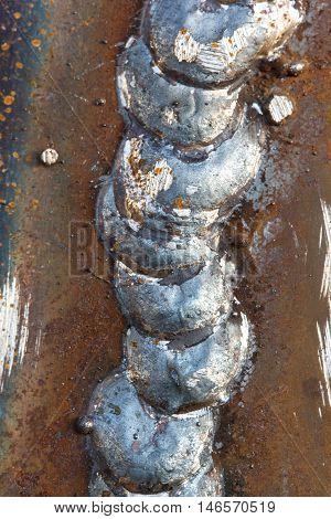 welding seam onto steel sheet metal Industrial steel welder in factory