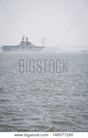 JERSEY CITY NJ - MAY 31 2016: USS Bataan (LHD 5) on the Upper New York Bay upon departing Manhattan marking the end of Fleet Week 2016, as seen from Liberty State Park.