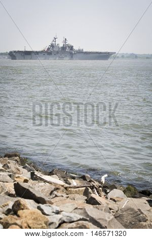 JERSEY CITY NJ - MAY 31 2016: USS Bataan (LHD 5) on the Upper New York Bay upon departing Manhattan marking the end of Fleet Week 2016, as seen from Liberty State Park.