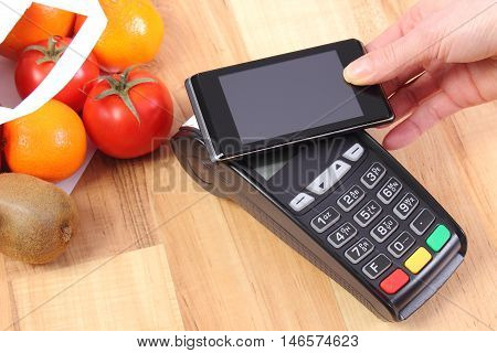 Payment Terminal And Mobile Phone With Nfc Technology, Fruits And Vegetables, Cashless Paying For Sh