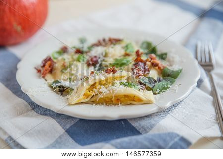 Home-made pasta ravioli or tortelli with pumpkin