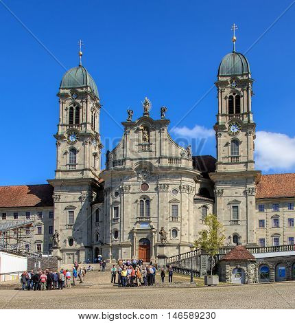 Einsiedeln, Switzerland - 8 September, 2015: people at the entrance to the Einsiedeln Abbey. Einsiedeln Abbey is a Benedictine monastery in the town of Einsiedeln in the Swiss Canton of Schwyz.