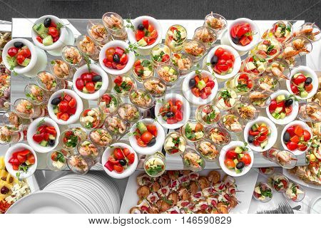 Banquet Table in restaurant served with different meals. Ready for wedding reception.