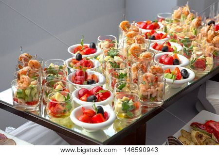 Banquet Table in restaurant served with different meals. Ready for wedding reception.