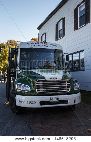 BAR HARBOR, USA - OCTOBER 15, 2015: Bus of the Acadia National Park Bus Tours waiting for passengers the front door of the bus is open