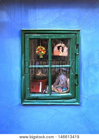 Vintage window in small medieval house on Golden Lane (Zlata Ulicka), Prague.