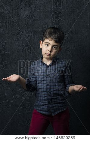 Boy in Strange pose with dark color outfit